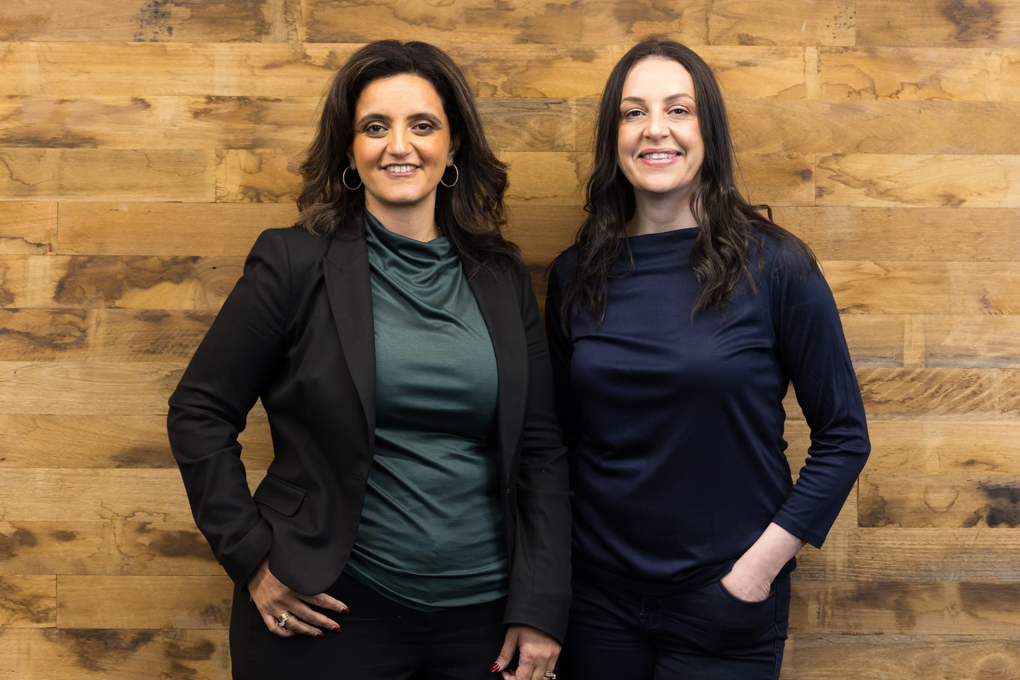 Founders Dalia Raphael and Galit Jona standing with the Delta team